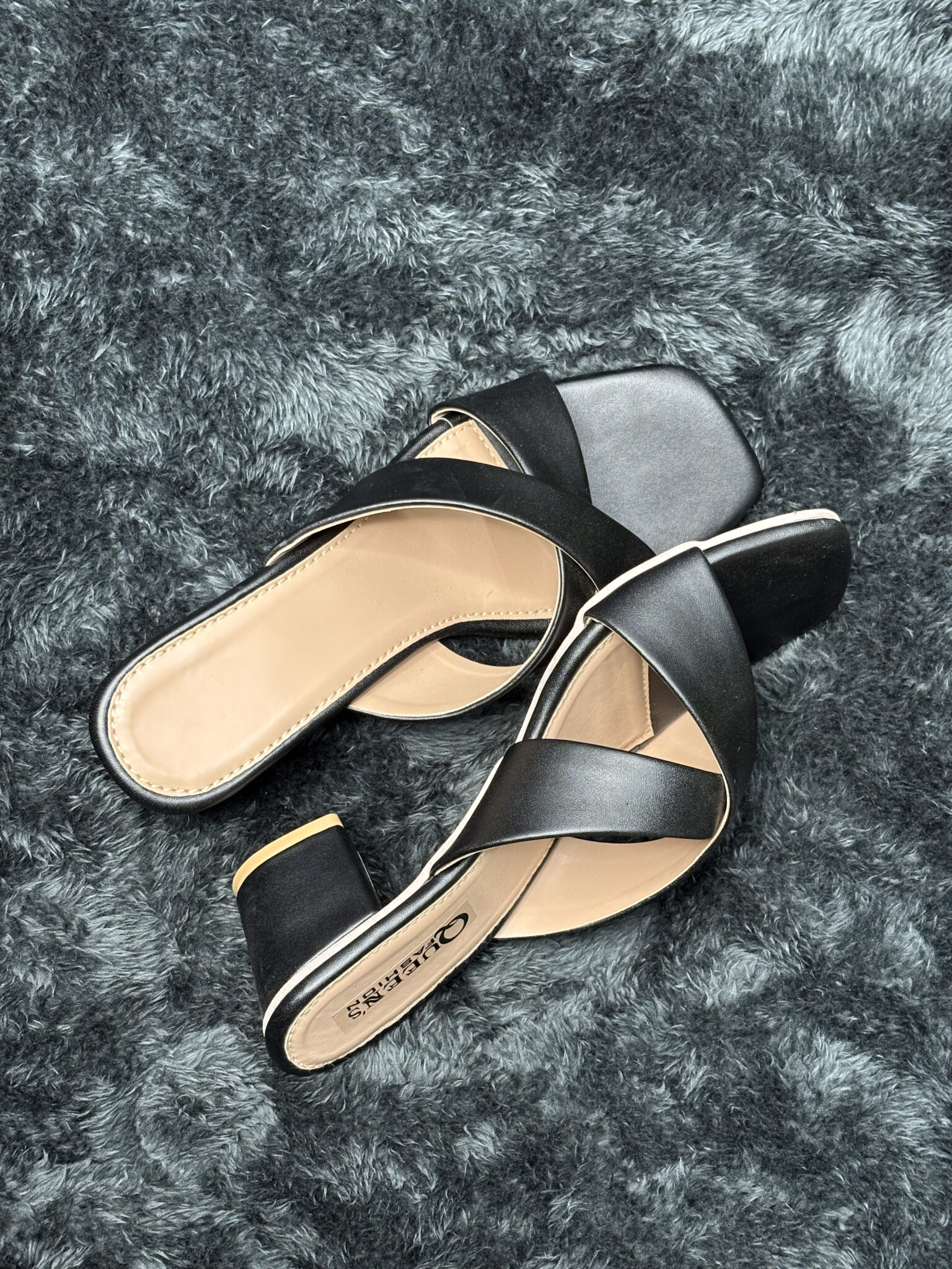 Black Criss-Cross Block Heel Sandals for women with a modern square toe and cushioned insole for comfort. Perfect for any occasion.