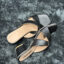 Black Criss-Cross Block Heel Sandals for women with a modern square toe and cushioned insole for comfort. Perfect for any occasion.