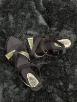 Alt Text: Black strappy sandals for women with a chic crisscross design and metallic accents, offering comfort and style for any occasion.